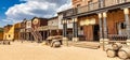 Vintage Far West town with saloon. Old wooden architecture in Wild West Royalty Free Stock Photo