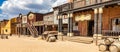 Vintage Far West town with saloon. Old wooden architecture in Wild West Royalty Free Stock Photo