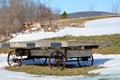 Vintage farm stand wagon with steel wheels in winter