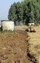 Vintage Farm Tractor ploughing agricultural field