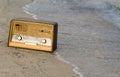 Vintage fashioned old radio on the beach Royalty Free Stock Photo