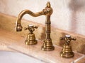 Vintage faucet with copper valve taps.