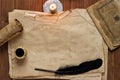 Old paper with candle and black quill, Blank background for tex Royalty Free Stock Photo