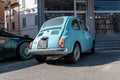 Vintage fiat 500 celeste car parked in the street