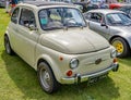 Vintage Fiat 500 on display at a public car show