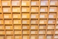 Old vintage file catalog box with many wooden index drawers in library archive Royalty Free Stock Photo