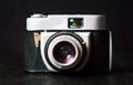 Old film camera against dark background Royalty Free Stock Photo