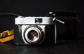 Old film camera against dark background Royalty Free Stock Photo