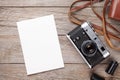 Vintage film camera and blank photo frame Royalty Free Stock Photo