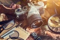 Vintage film camera with dust on dry leaf and wooden in nature Royalty Free Stock Photo