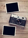 Vintage film camera and two blank photo frames Royalty Free Stock Photo