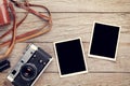 Vintage film camera and two blank photo frames Royalty Free Stock Photo