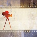 Vintage film strip background and old cinecamera Royalty Free Stock Photo