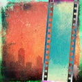 Vintage film strip on red grunge city skyline Royalty Free Stock Photo