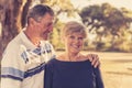 Vintage filter portrait of American senior beautiful and happy mature couple around 70 years old showing love and affection smilin Royalty Free Stock Photo
