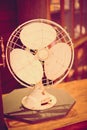 Vintage filter: Vintage fan on wood table in old shop