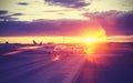 Vintage filtered picture of airport at sunset, travel concept. Royalty Free Stock Photo