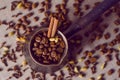 Vintage filtered turkish coffee pot filled with coffee beans on canvas background Royalty Free Stock Photo