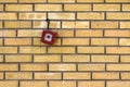 Vintage fire alarm box mounted on the brick wall Royalty Free Stock Photo