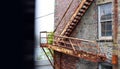 Vintage fire escape stairs on brick building Royalty Free Stock Photo