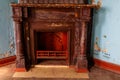 Vintage fireplace in living room of abandoned palace