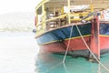 Vintage fishing boat in harbor. Azure sea in the port of Rethymno Crete. Royalty Free Stock Photo