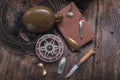 Vintage fishing still life. Fishing things on the table. Knife and tackle on the table. Top Royalty Free Stock Photo