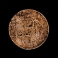 Vintage five bani coin isolated on black background.