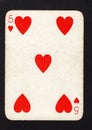 A vintage five of hearts playing card on a black background.