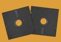 Vintage Floppy Disk 5.25 inch. Retro storage technology isolated on orange background Royalty Free Stock Photo