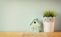 Vintage Flower pot and lantern as a bird house against mint wall and antique lace fabric Royalty Free Stock Photo