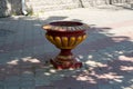 Vintage flower vase on the sidewalk in a Park or garden Royalty Free Stock Photo