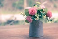 Vintage flowers, beautiful soft pink roses in vase. Royalty Free Stock Photo