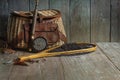 Vintage fly fishing rod creel and net on old wood background