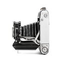 Vintage folding camera with bellows, side view isolated on a white Royalty Free Stock Photo