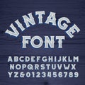 Vintage font. Retro alphabet. Messy letters on a grunge wooden background. Royalty Free Stock Photo