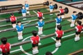 Vintage Foosball, Blue and Red Players Team in Table Soccer or Football Kicker Game, Selective Focus. table game. Boy Royalty Free Stock Photo