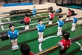 Vintage Foosball, Blue and Red Players Team in Table Soccer or Football Kicker Game, Selective Focus. table game. Boy Royalty Free Stock Photo