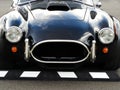 Vintage Ford Cobra black sports car at Vintage Grand Prix