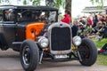 Vintage Ford Model A 1927 car with orange bonnet in a park Royalty Free Stock Photo