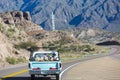 Vintage Ford pick up driving on Route 7 between Chile and Argentina