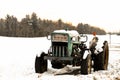 A vintage Ford tractor in the snow