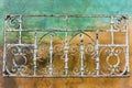 Vintage forged iron ornaments; colorful wall background, California Royalty Free Stock Photo