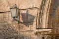 Vintage lantern and its shadow on an old wall. Details. Jerusalem, Israel Royalty Free Stock Photo