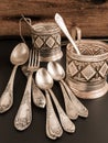 Composition from old dishes on wooden background in vintage style