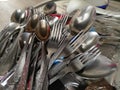 Vintage forks and spoons in a pile in the kitchen Royalty Free Stock Photo