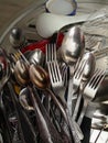 Vintage forks and spoons in a pile in the kitchen Royalty Free Stock Photo