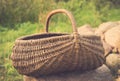 Vintage foto of Empty basket / Braided basket basket on green lawn