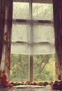 Vintage foto of the old window. tomatoes lie near a window