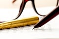 Vintage fountain pen on a letter, glasses behind Royalty Free Stock Photo